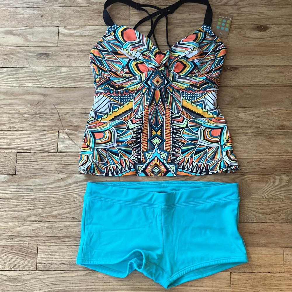 Title Nine. Women’s Swim Suit. Small swim shorts and 32 D Swim Shirt. NWT.